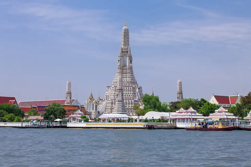 Wat Arun seen across the Chao Phraya river, Bangkok