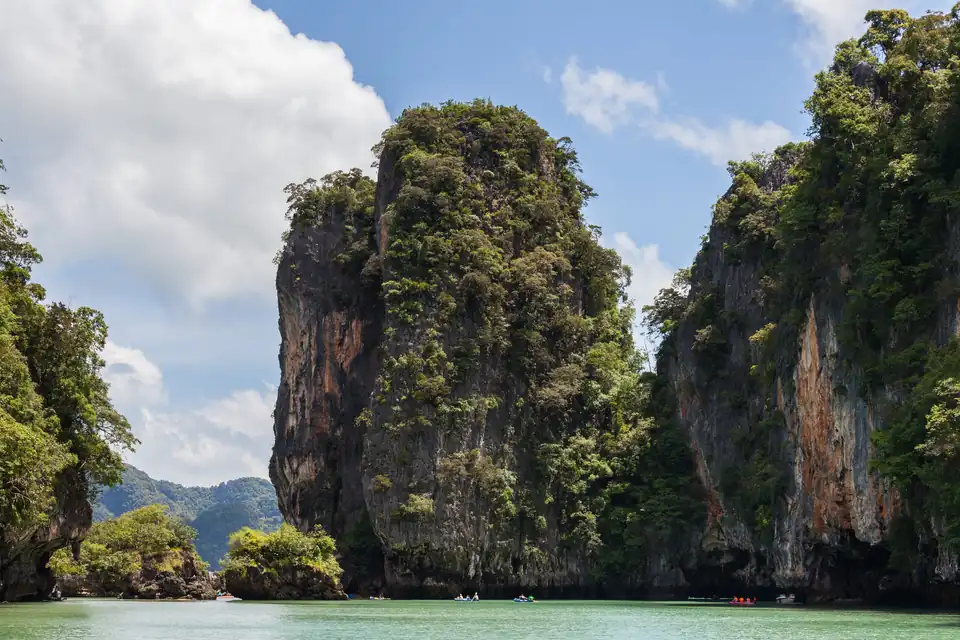 The cliffs of Ko Phanak over green water