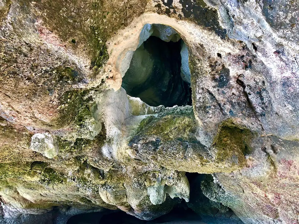 A sea cave opening in the limestone at Phang Nga