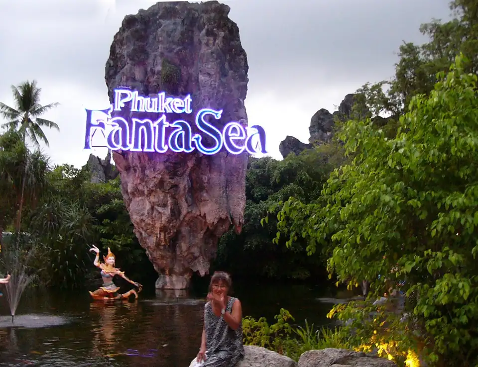 The Phuket FantaSea sign on a rock in the entrance pond