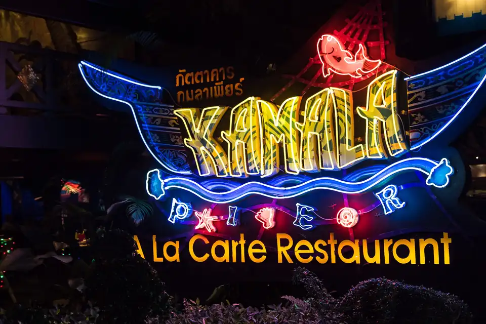 The neon sign of the Kamala Pier restaurant