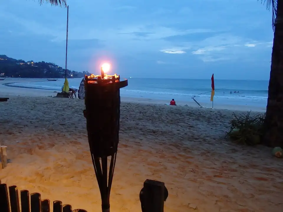 Kamala bay at dusk with a red flag flying