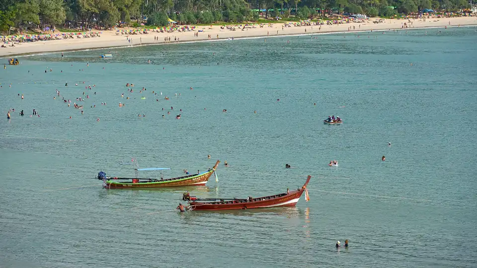 Kata in high season with longtails moored off the sand