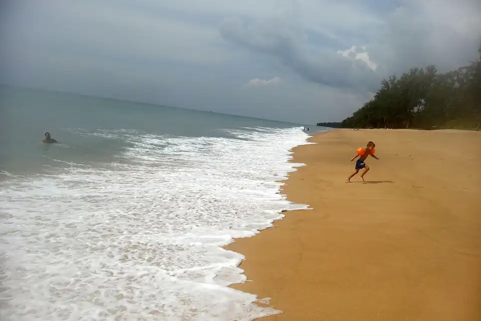 Surf on the empty sand at Mai Khao