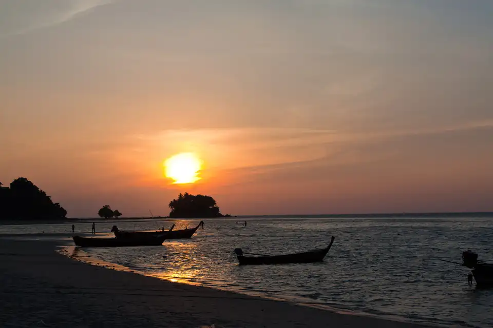 Sunset over the boats at Nai Yang
