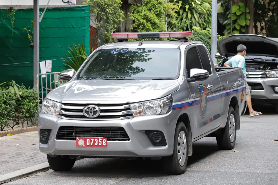 A Thai Tourist Police pickup at the Rama VIII Bridge in Bangkok