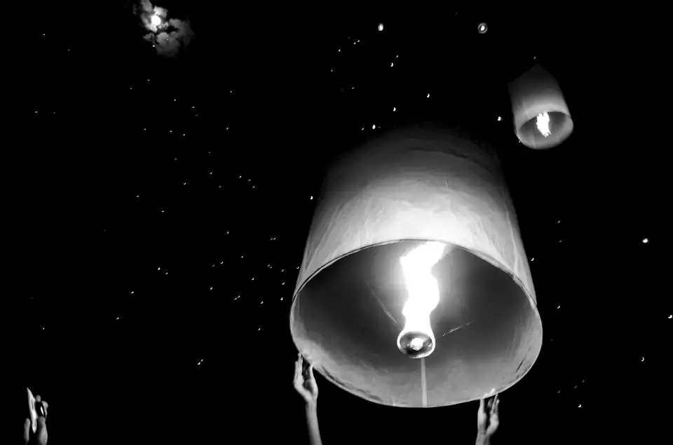 Sky lanterns and fireworks at a northern Thai festival