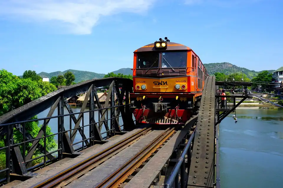 A State Railway of Thailand locomotive crossing the bridge over the River Kwai at Kanchanaburi