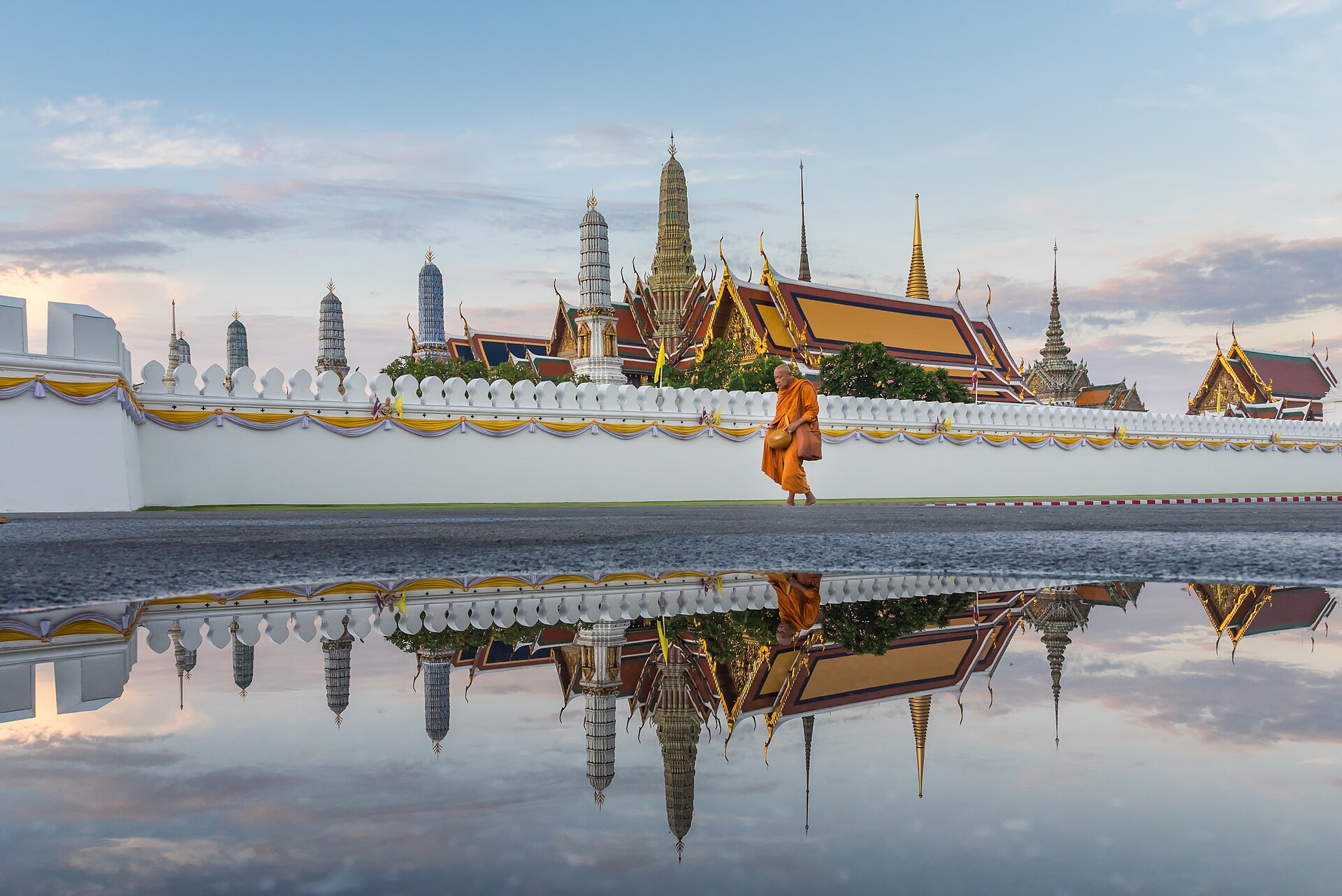 Monks and modestly dressed visitors at a temple in Chiang Mai