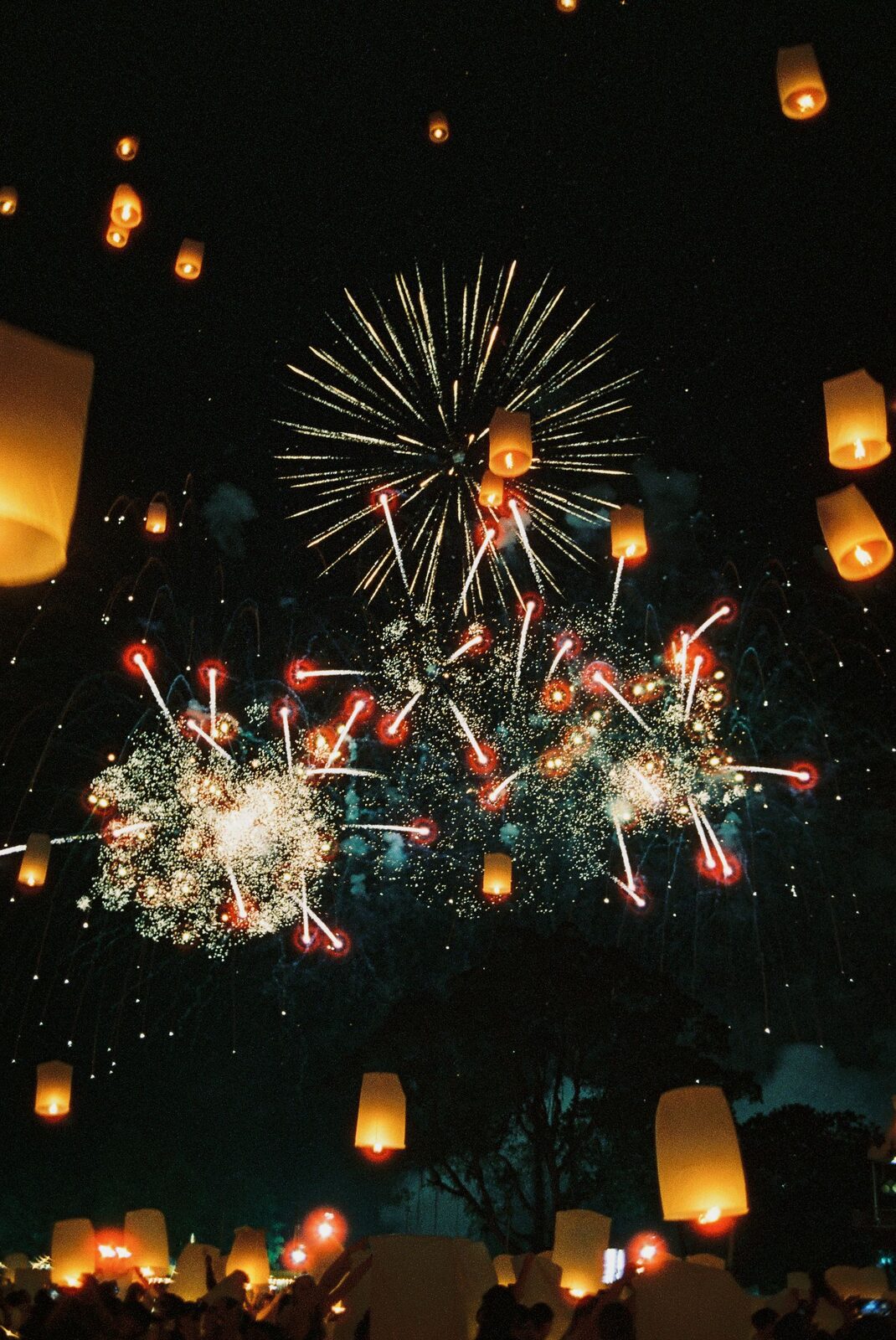 Sky lanterns and fireworks at a northern Thai festival